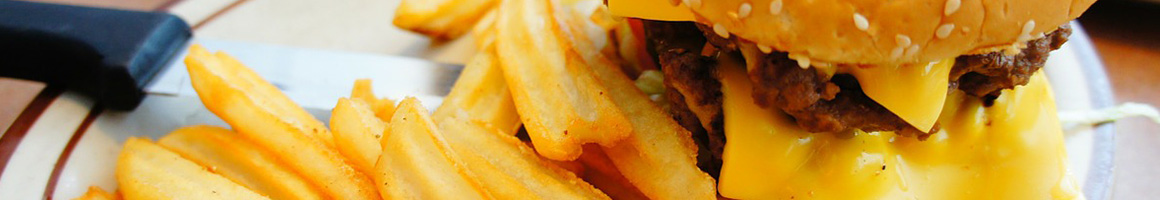 Eating American (Traditional) Burger at Squeeze Inn Hamburgers restaurant in Napa, CA.
